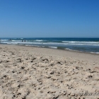 Blauer Himmel und Strand