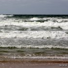 Strand und Wellen
