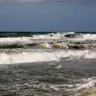 Strand und Wellen