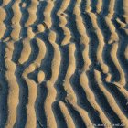 Wellen im Sand
